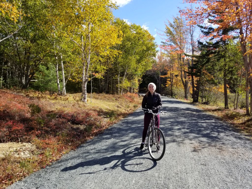 Amy biking in Acadia National Park, ME